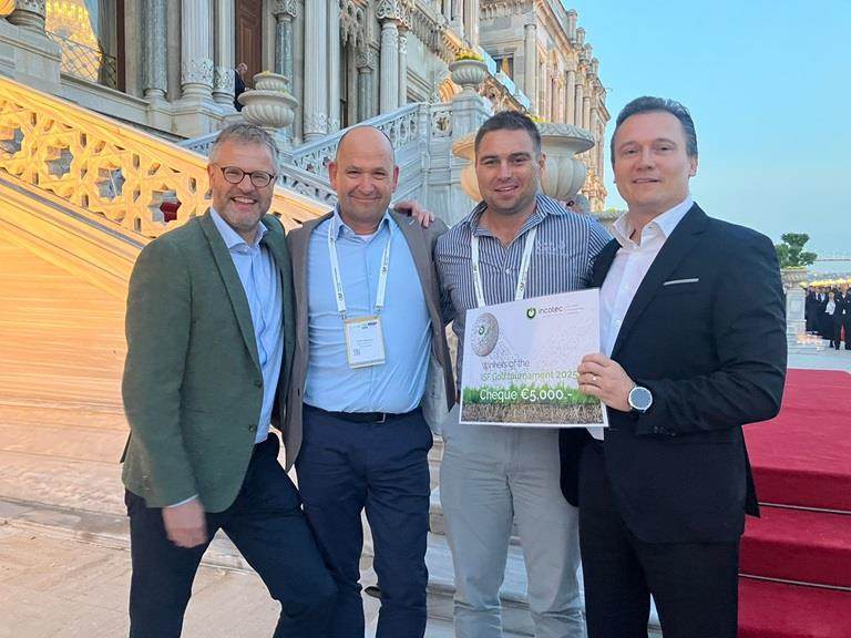 Bruno Hoeltgebaum, Incotec's Global Business Director, presents the ISF golf tournament winning team with a cheque for 5000 euros to be donated to charity