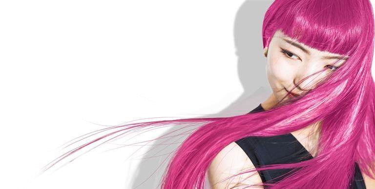 East asian woman in her 20s with long, straight, bright pink hair.