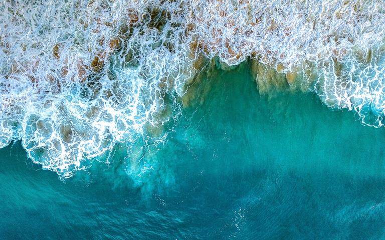 ariel shot of a breaking wave showing texture