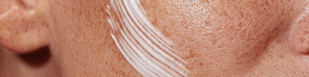 sustainable lotion on freckled skin